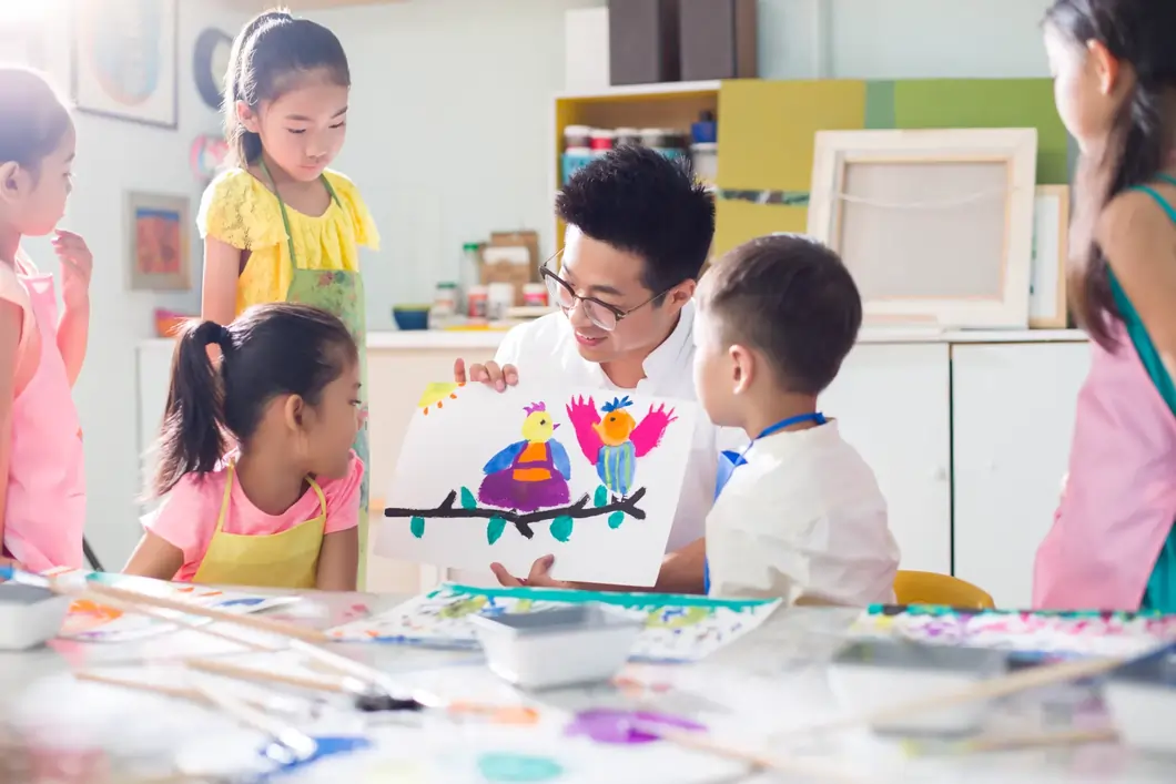 Children in an art class with teacher